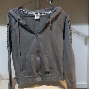 Pink hoodie med great and black.